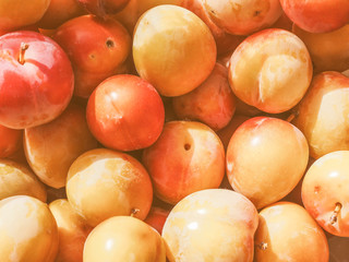 Retro looking Prune fruits background