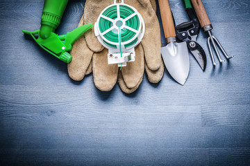 set of garden tools on painted wooden board