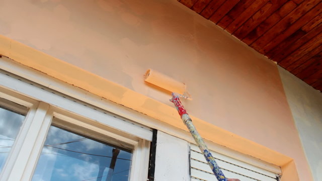 Painter whitewashed facade of a house, Video clip