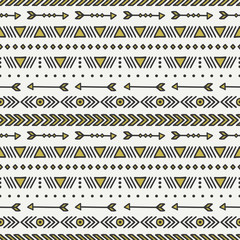 Hand drawn gold geometric ethnic seamless pattern. Wrapping