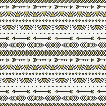 Hand drawn gold geometric ethnic seamless pattern. Wrapping