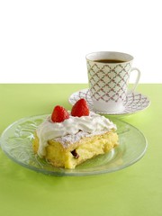 tasty cake with cream and strawberries for cup coffee