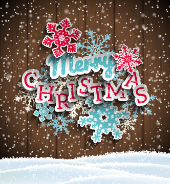 Colorful decorative text Merry Christmas on wooden background