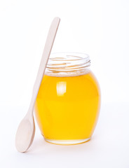 Glass jar full of honey on a white background. food, medicine