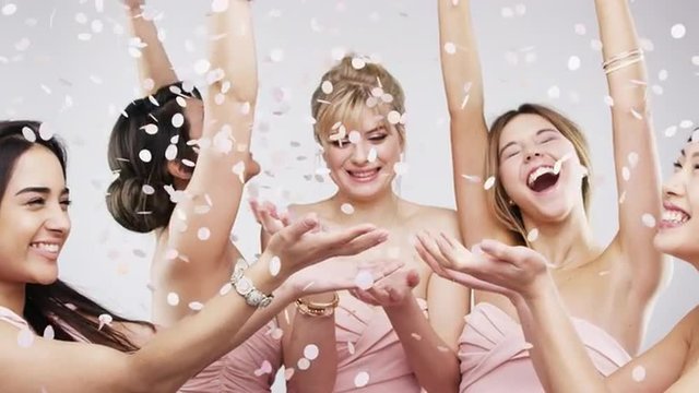 Beautiful bridesmaids throwing confetti slow motion wedding photo booth series