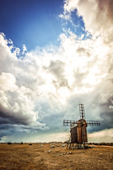 After the storm, Swedish traditional windmill and stone ship under the dramatic clouds © Kevin Cho