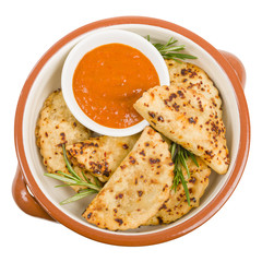 Pierogi - Baked dumplings filled with meat and served with a spicy sour cream based dip.
