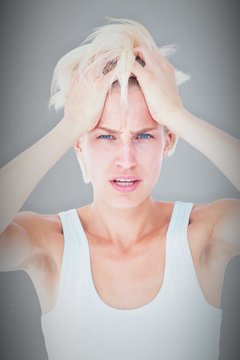 Composite image of sad blonde woman with head pain