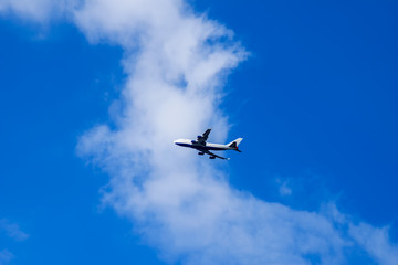 Fototapeta na wymiar Passenger Airplane flying into the clouds over Windsor Castle, UK