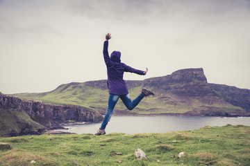 Woman jumping. Scotland - 91562553
