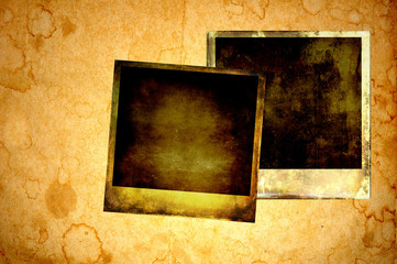 Blank instant photos on grunge paper background