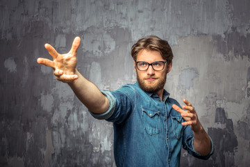 Young man showing hands as a magician