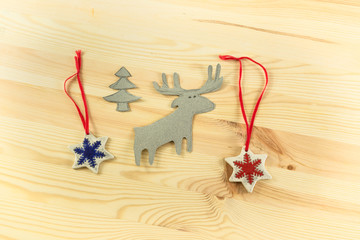 Christmas tree with Reindeer and snowflakes on a wooden backgrou