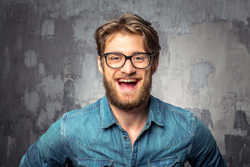 Young handsome man in glasses smiling