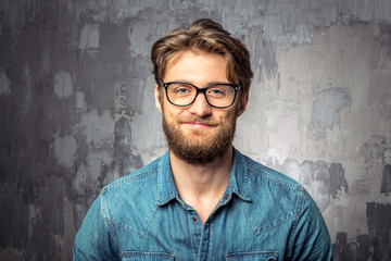 Young handsome man in glasses smiling