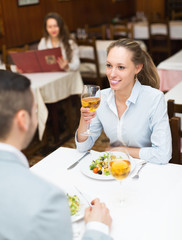Woman having dinner with guy