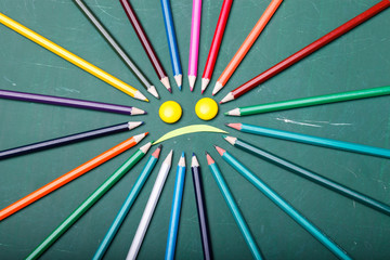Pencils around smile