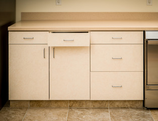 Kitchen counter and cabinets with cabinet drawer open