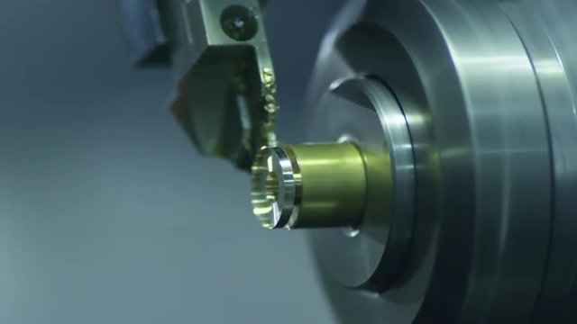 CNC Lathe Machine Produces Metal Detail on Factory.