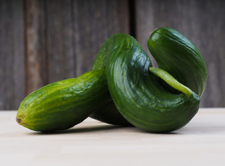 two cucumbers on old table