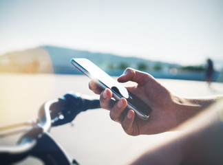 Smart phone and bicycle on the park background