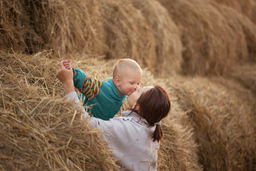 child playing in the straw