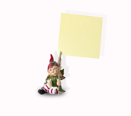 Naklejka premium Statuetta di un folletto con pinza porta biglietti