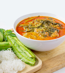 pork red curry with vegetable and noodle on wood table