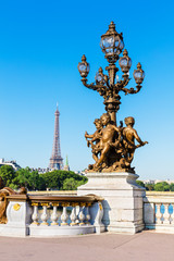 Fototapeta na wymiar Pont Alexandre III Bridge (Lamp post details) and Eiffel Tower,