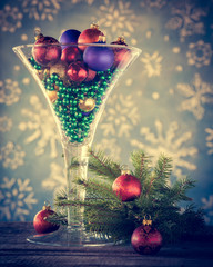 Christmas decoration - Wine glass filled with christmas tree bal