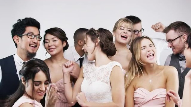 Multi racial group friends dancing slow motion wedding photo booth series