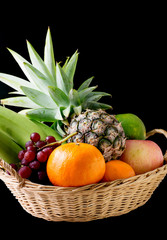 mixed fruits on black background