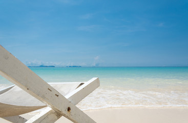beach chair on beach with blue sky