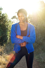 Fitness woman standing outside with blue sweatshirt