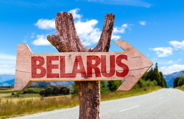 Belarus wooden sign with road background