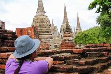 Foto op Plexiglas I am looking Ayutthaya historical park in Thailand.(Person in image is me. I take photo myself.I using a tripod and set  time of camera) © nidsaowapa