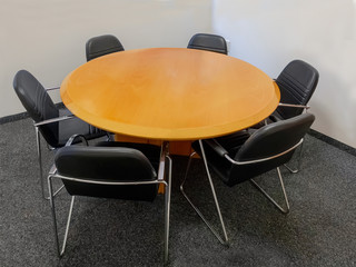 Meeting table and black chairs