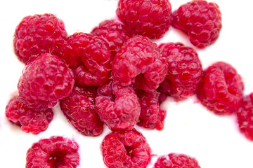 closeup of raspberries with yogurt