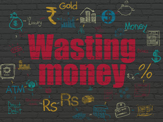 Money concept: Wasting Money on wall background