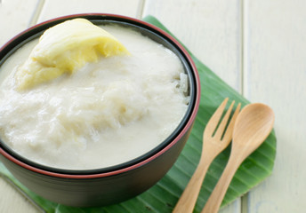Durian sticky rice on black bowl and banana leaf