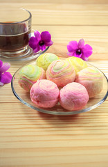 Chinese pastry in rainbow color with coffee