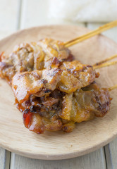 Closeup pork barbecue on wooden dish
