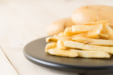 french fries on wood background