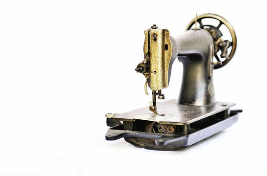 Old Sewing Machine On A White Background