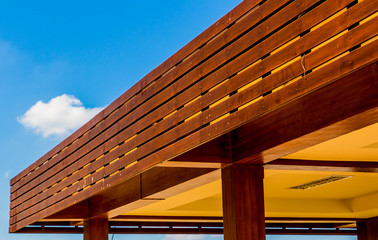 Roof of a new wooden house with a blue sky in the background