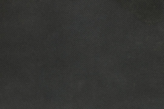 Closeup fabric at the black mouse pad background