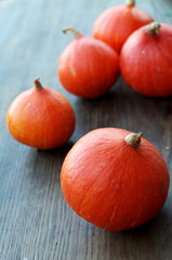 Pumpkins on wooden background