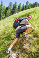 Naklejka na ściany i meble woman makes mountain hiking