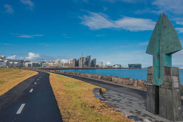 View of Reykjavik's downtown, embankment,  ocean and bicycle path