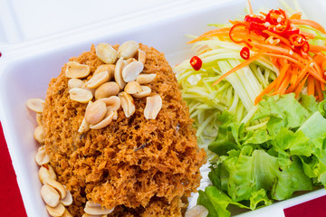 Crispy catfish salad in styrofoam box by Thailand street food ve